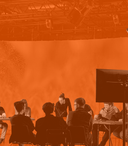 People in a studio workshop with VP screen in background