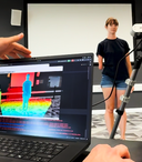 Workshop-AI for Film and Digital Content Production Hero - woman standing in a room with limb difference and computer showing heat map