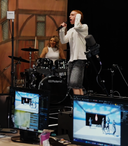 LiveLab_Aldag woman drummer and man guitarist in AV studio