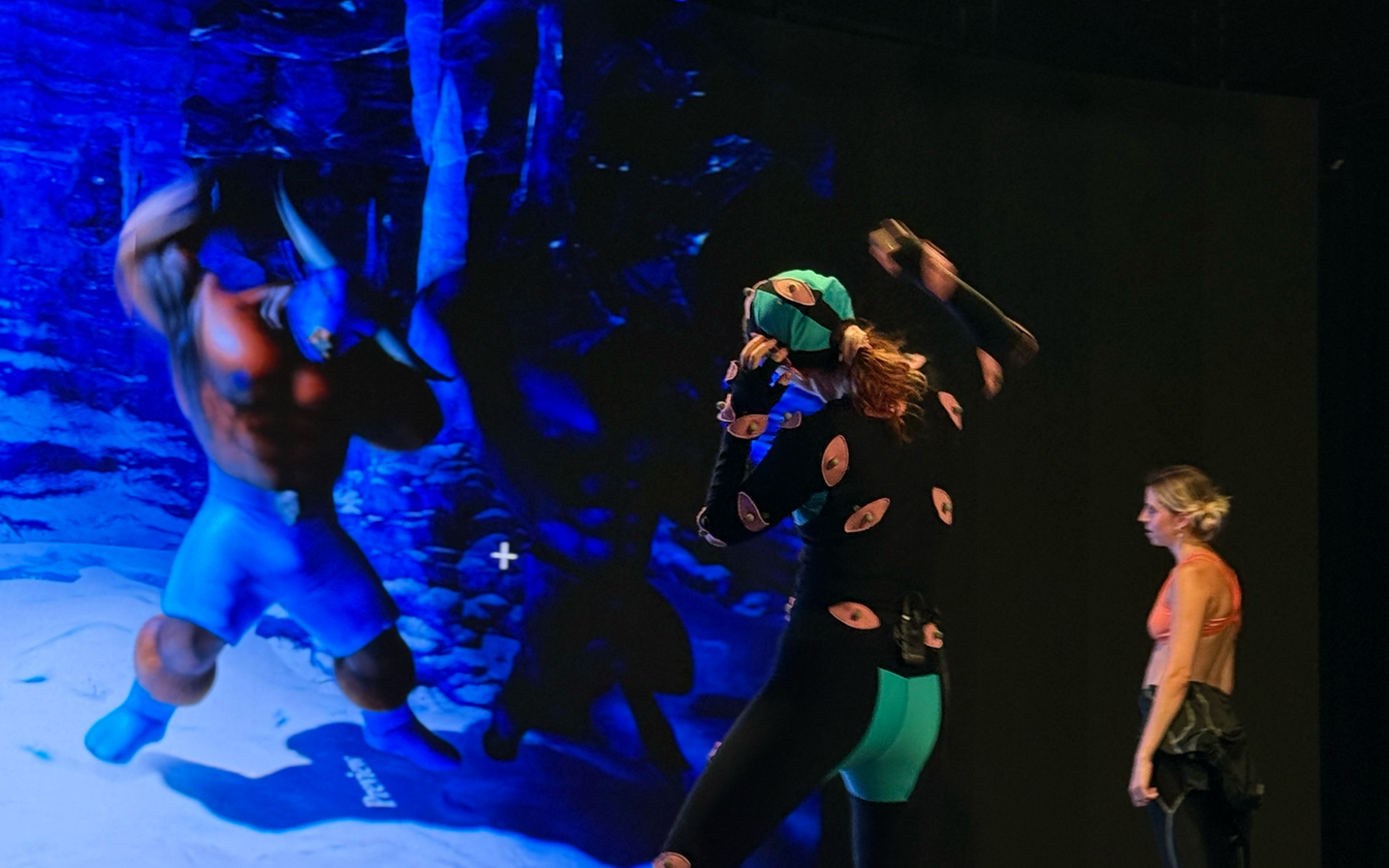 Ornagh Lynch wearing a motion capture suit and performing inside a MoCap studio at Target Studio, as part of the Immersiv.es CoSTAR Ideate project