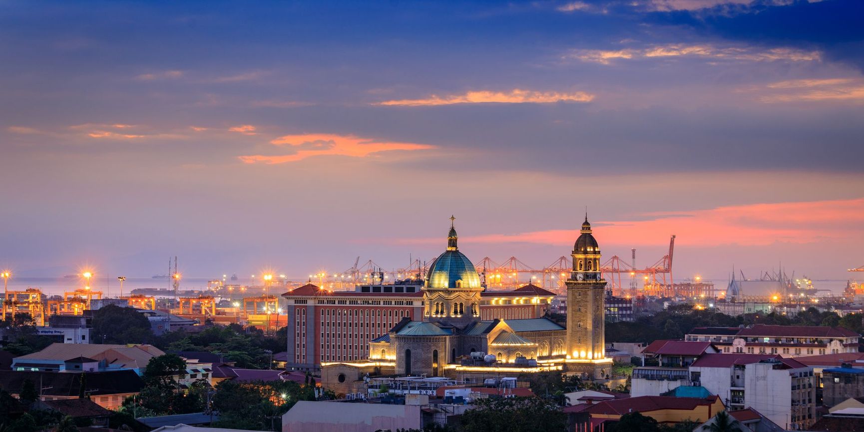Intramuro District, Manila. City skyline in the evening at sunset