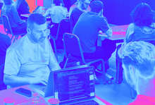 blue pink tint of people at a workshop 