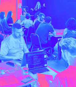 blue pink tint of people at a workshop 