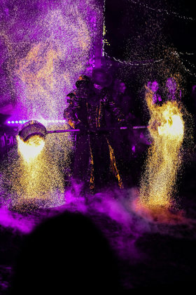 a person surrounded by fragmented purple and yellow light 