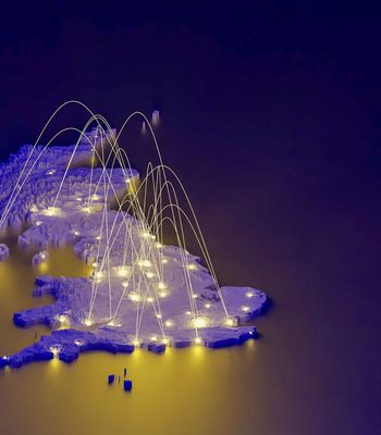 A stylized 3D map of the UK with glowing points connected by curved light trails, set against a dark blue background.