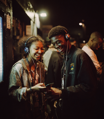CSNationalLab_P3R_17 man and woman enjoying music using headsets and phones