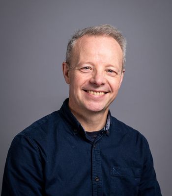 Headshot of Professor Adrian Hilton, Head of Creative AI, CoSTAR National Lab