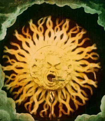 Still from an early animation showing a sun swallinging a train By Georges Méliès - Méliès: Fairy Tales in Color, Public Domain, Creative Commons