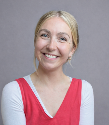 A smiling woman with a red top