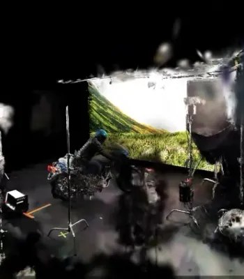 A motorbike rider on a Scottish Highlands road, used in the CoSTAR Realtime Lab launch film showcasing virtual production and VFX techniques