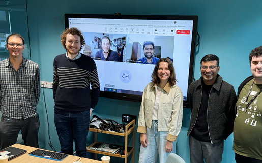 The first cohort of CoSTAR National Lab PhD students, photographed together in October 2025