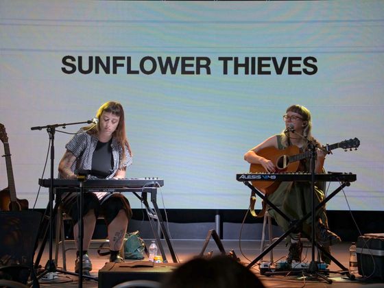 Musicians performing on stage at CoSTAR Live Lab