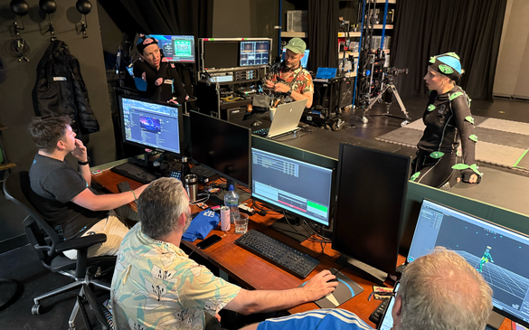 Group of people behind control desk with company Immersiv.es at Target Studio as part of National Lab's Ideate programme 