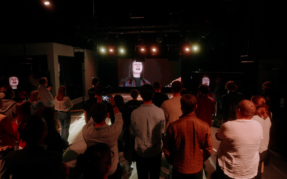 The audience in CoSTAR Live Lab enjoying Marnie Glum's performance being rendered and live streamed from York.