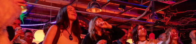 3 Girls dancing to indie music at a gig