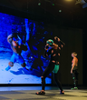 Ornagh Lynch wearing a motion capture suit and performing inside a MoCap studio at Target Studio, as part of the Immersiv.es CoSTAR Ideate project